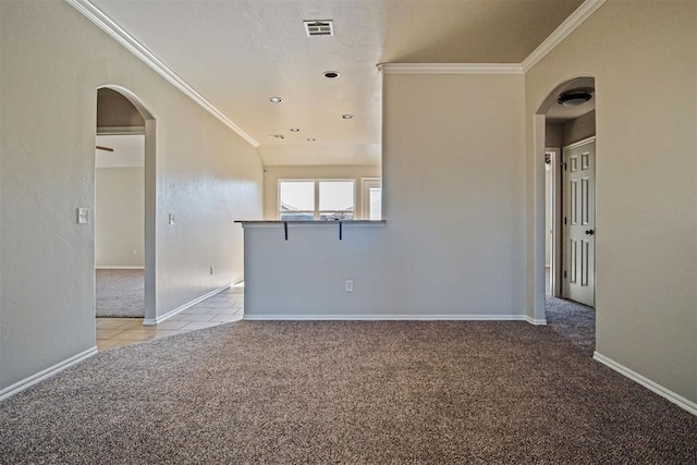 unfurnished room featuring crown molding, light carpet, and a textured ceiling