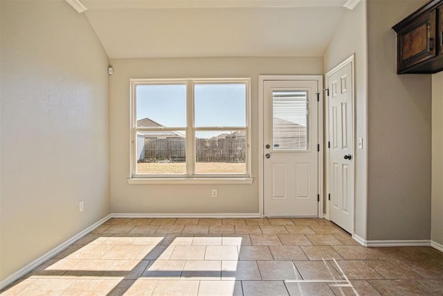 interior space with light tile patterned floors and vaulted ceiling