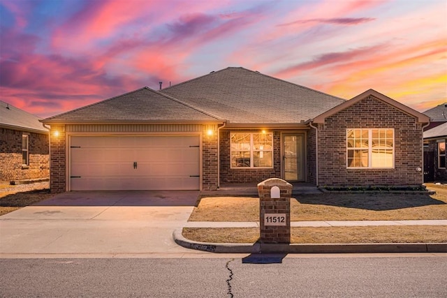 ranch-style home featuring a garage