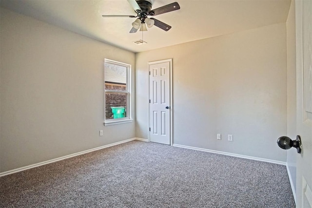 empty room with carpet floors and ceiling fan