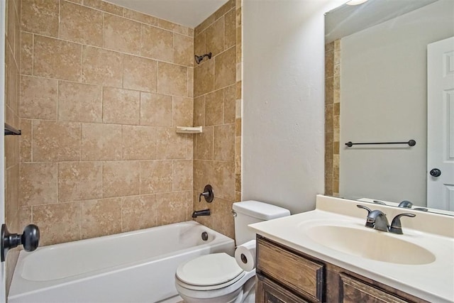 full bathroom with vanity, toilet, and tiled shower / bath