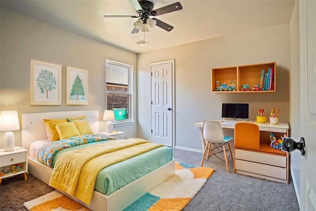 carpeted bedroom with ceiling fan and a closet