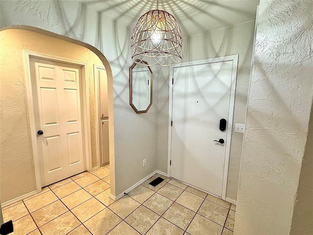 entryway featuring light tile patterned floors