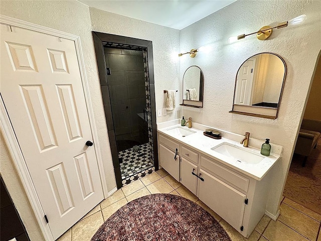 bathroom with vanity, tile patterned floors, and walk in shower