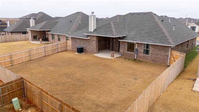 back of property featuring central AC and a patio area