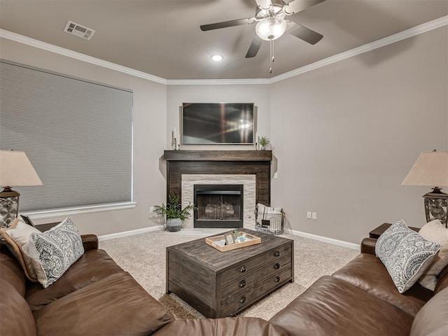 carpeted living room featuring ceiling fan and ornamental molding