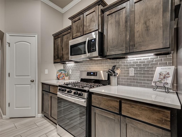 kitchen featuring stainless steel appliances, ornamental molding, backsplash, and dark brown cabinetry