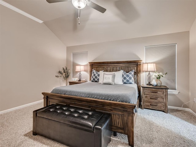 carpeted bedroom with vaulted ceiling and ceiling fan