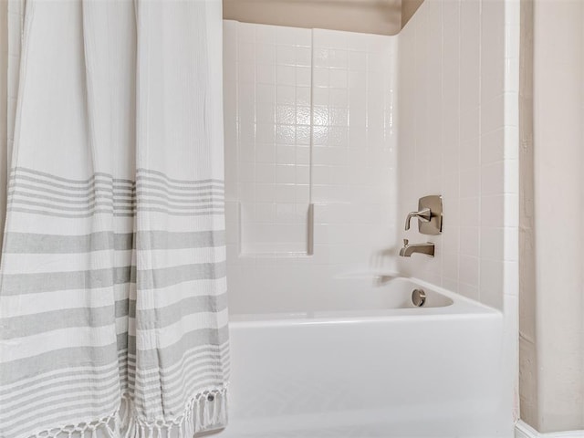 bathroom with shower / bathtub combination with curtain