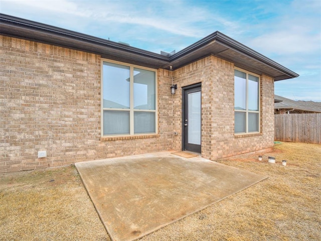 back of property with a patio