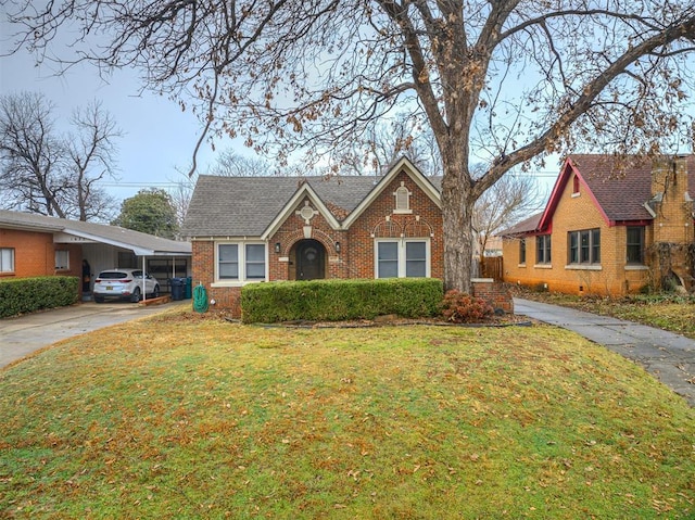 view of front of property with a carport and a front lawn