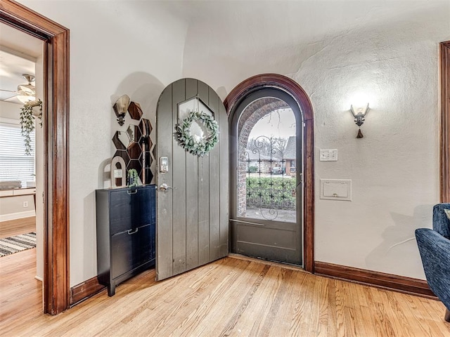 foyer entrance featuring ceiling fan and light hardwood / wood-style floors