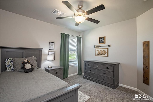 bedroom featuring ceiling fan and light carpet