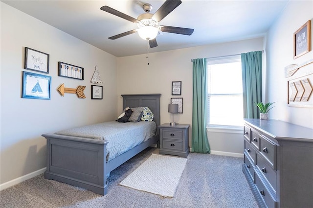 bedroom featuring light colored carpet and ceiling fan