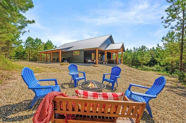 view of playground with an outdoor fire pit