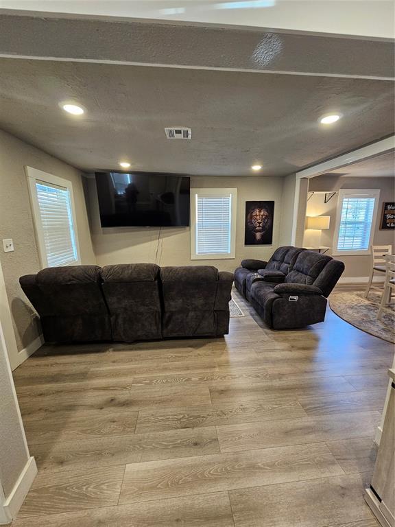 living room with light hardwood / wood-style floors