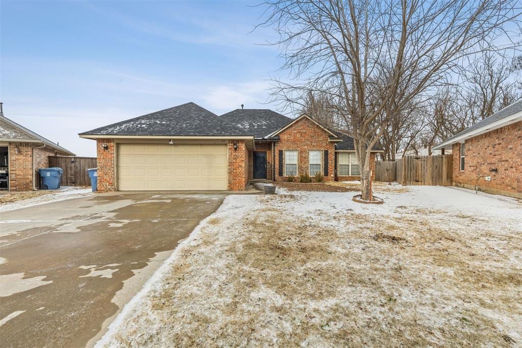 ranch-style house featuring a garage