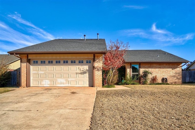 single story home featuring a garage