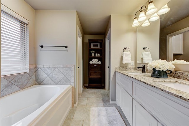 bathroom featuring vanity, a bathing tub, and tile patterned floors