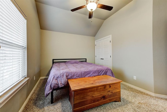 carpeted bedroom with ceiling fan and lofted ceiling