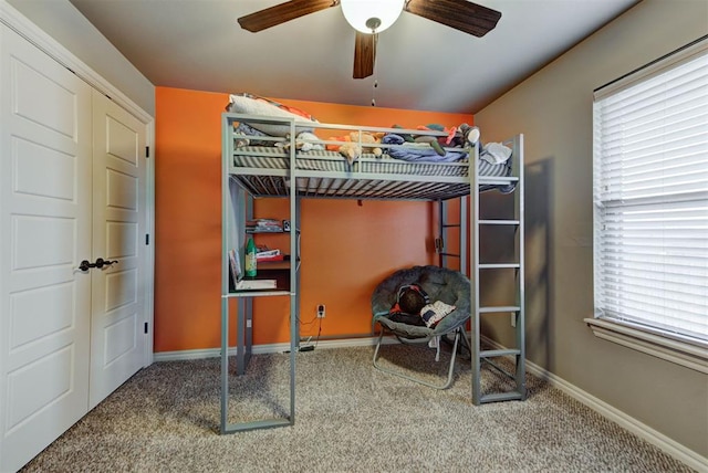 bedroom with ceiling fan and carpet