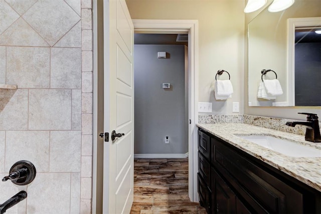 bathroom featuring hardwood / wood-style flooring and vanity