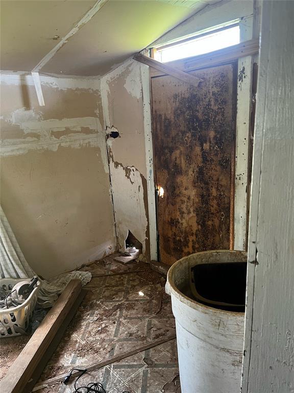 bathroom with lofted ceiling