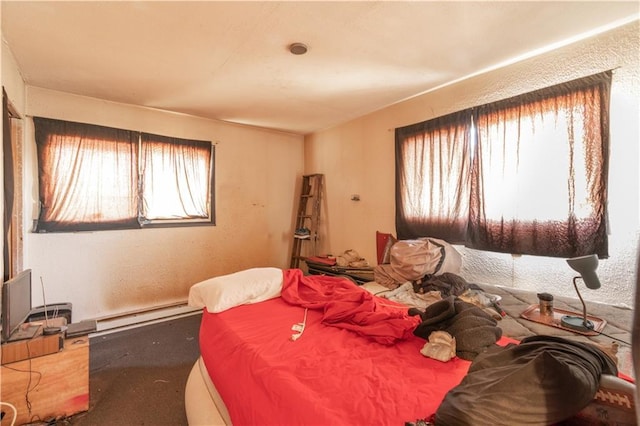 bedroom featuring baseboard heating