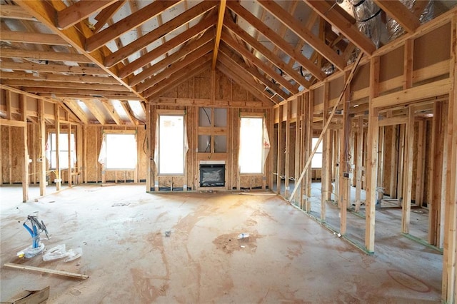 miscellaneous room with lofted ceiling