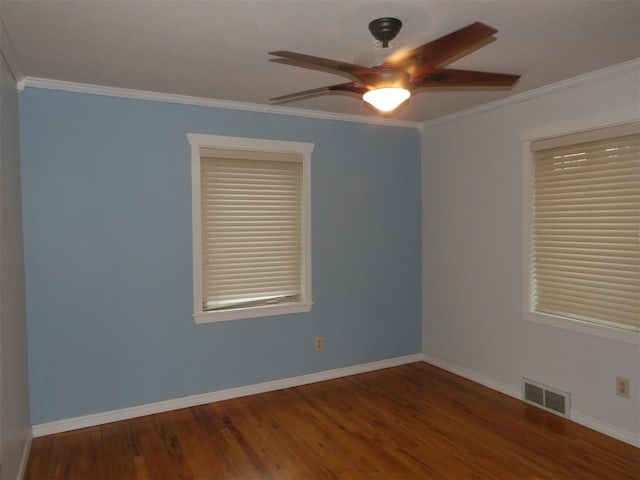 unfurnished room featuring wood-type flooring, ornamental molding, and ceiling fan