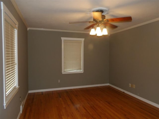 empty room with crown molding, dark hardwood / wood-style floors, and ceiling fan