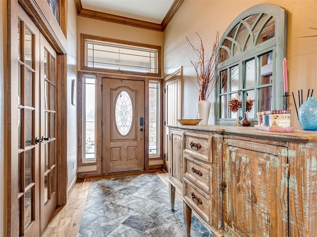 foyer featuring ornamental molding