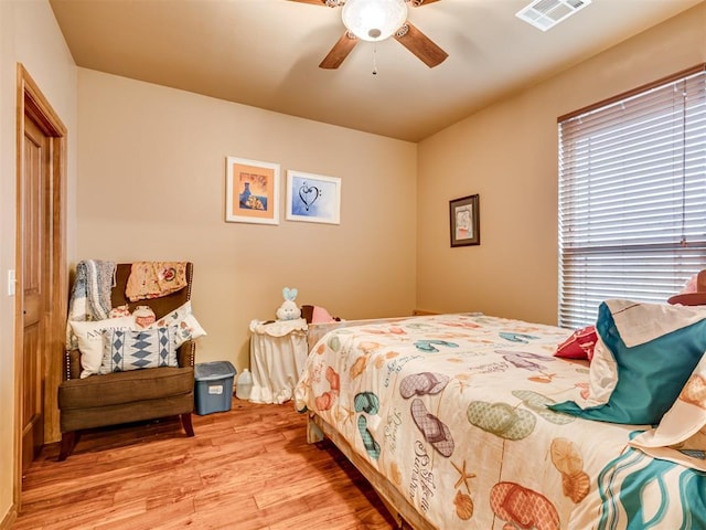 bedroom featuring ceiling fan and light wood-type flooring