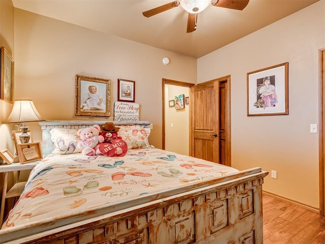 bedroom with ceiling fan and light wood-type flooring