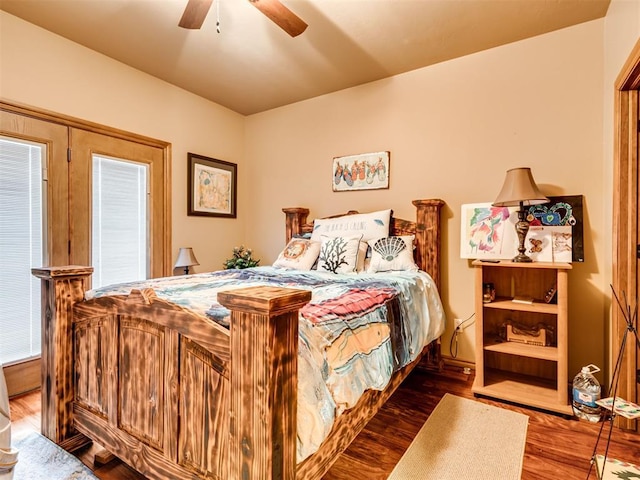 bedroom featuring ceiling fan and dark wood-style flooring