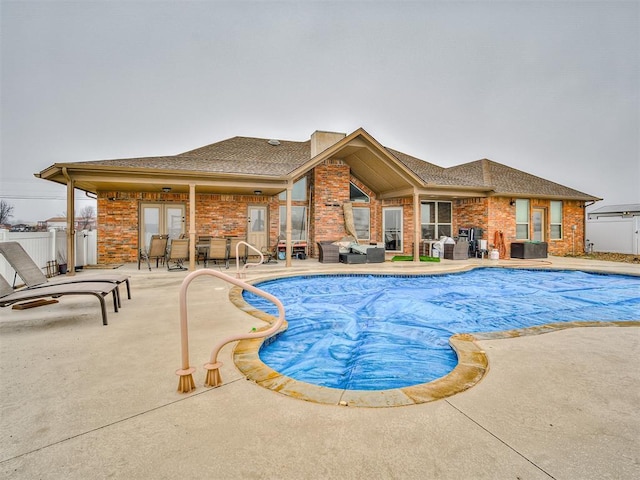 view of swimming pool with a patio area