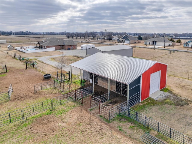 drone / aerial view with a residential view and a rural view