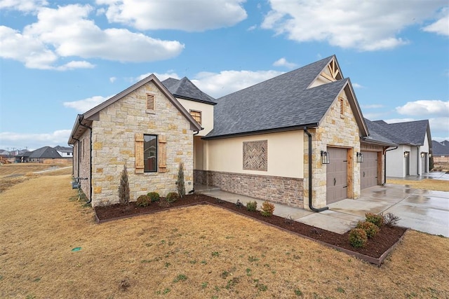 view of home's exterior with a garage and a yard