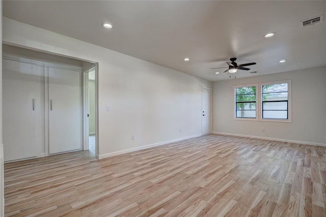 unfurnished room featuring light hardwood / wood-style flooring and ceiling fan