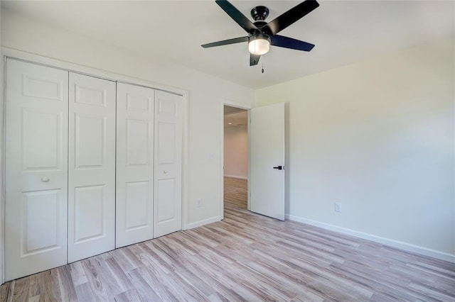 unfurnished bedroom with a closet, ceiling fan, and light hardwood / wood-style flooring