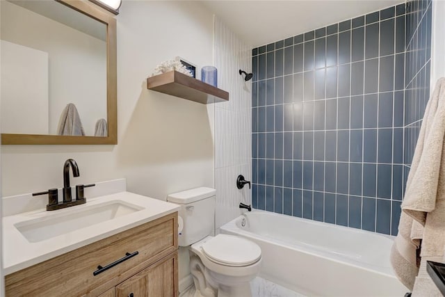 full bathroom featuring vanity, toilet, and tiled shower / bath combo