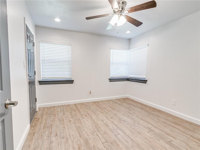 unfurnished room featuring ceiling fan and light hardwood / wood-style flooring