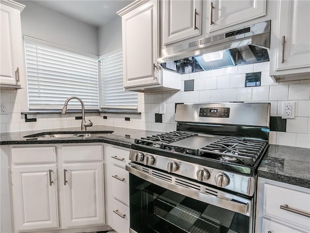 kitchen with tasteful backsplash, sink, gas stove, and white cabinets