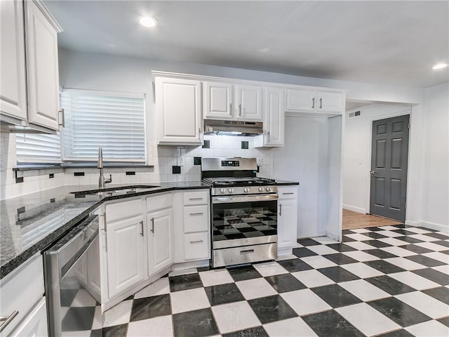 kitchen featuring white cabinetry, appliances with stainless steel finishes, and sink