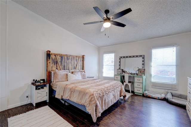 bedroom featuring ceiling fan, vaulted ceiling, dark hardwood / wood-style floors, and a textured ceiling