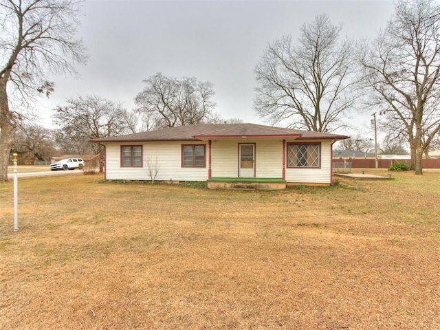 ranch-style house with a front lawn and covered porch