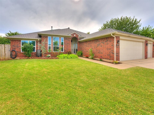 ranch-style house with a garage and a front lawn