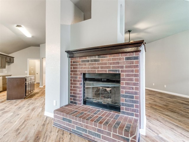 room details featuring wood-type flooring and a fireplace