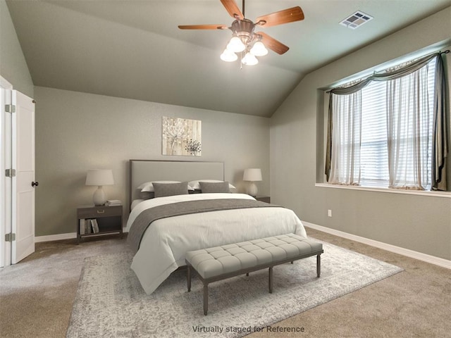 carpeted bedroom featuring lofted ceiling and ceiling fan