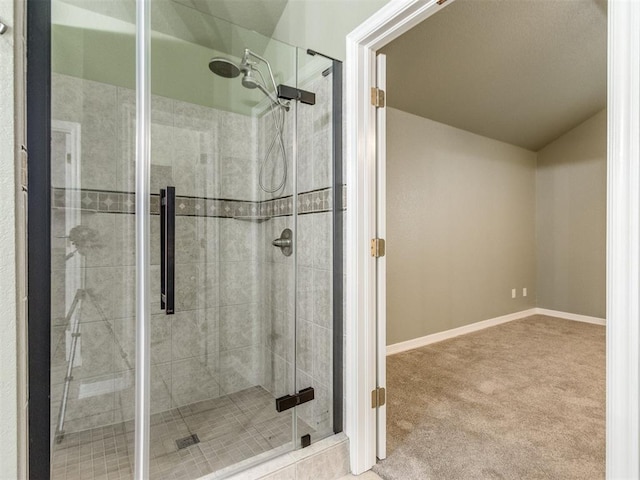 bathroom with a shower with shower door